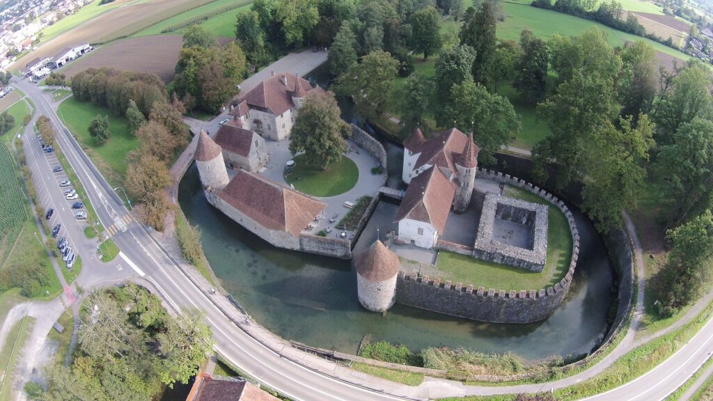 Historic Hallwyl Castle on Lake Hallwil surrounded by calm water, Aargau, Switzerland.1