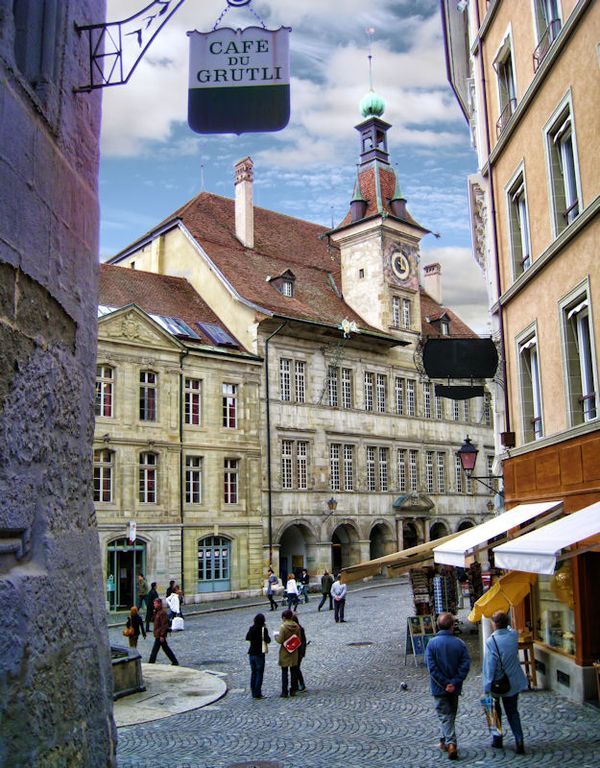 “Narrow cobblestone street among historic buildings in Lausanne old town, Canton Vaud, Switzerland.”