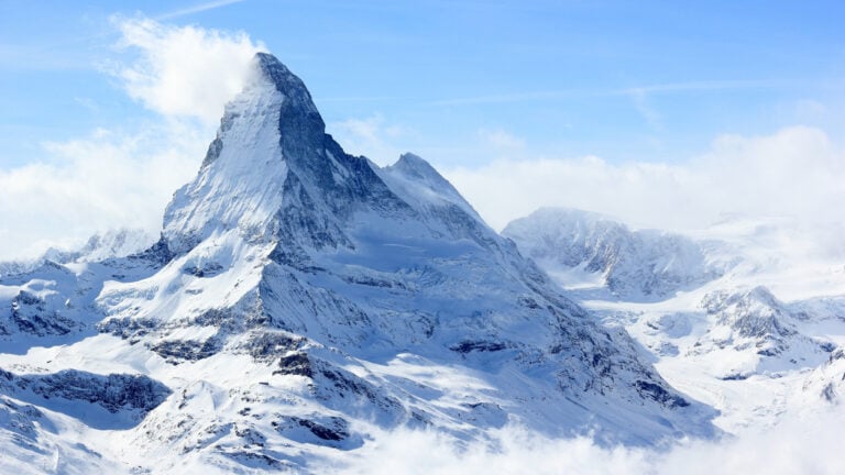 Snow‑capped Matterhorn peak rising above alpine meadows at dawn, Valais, Switzerland.2