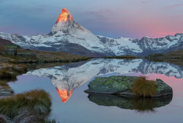 Snow‑capped Matterhorn peak rising above alpine meadows at dawn, Valais, Switzerland1