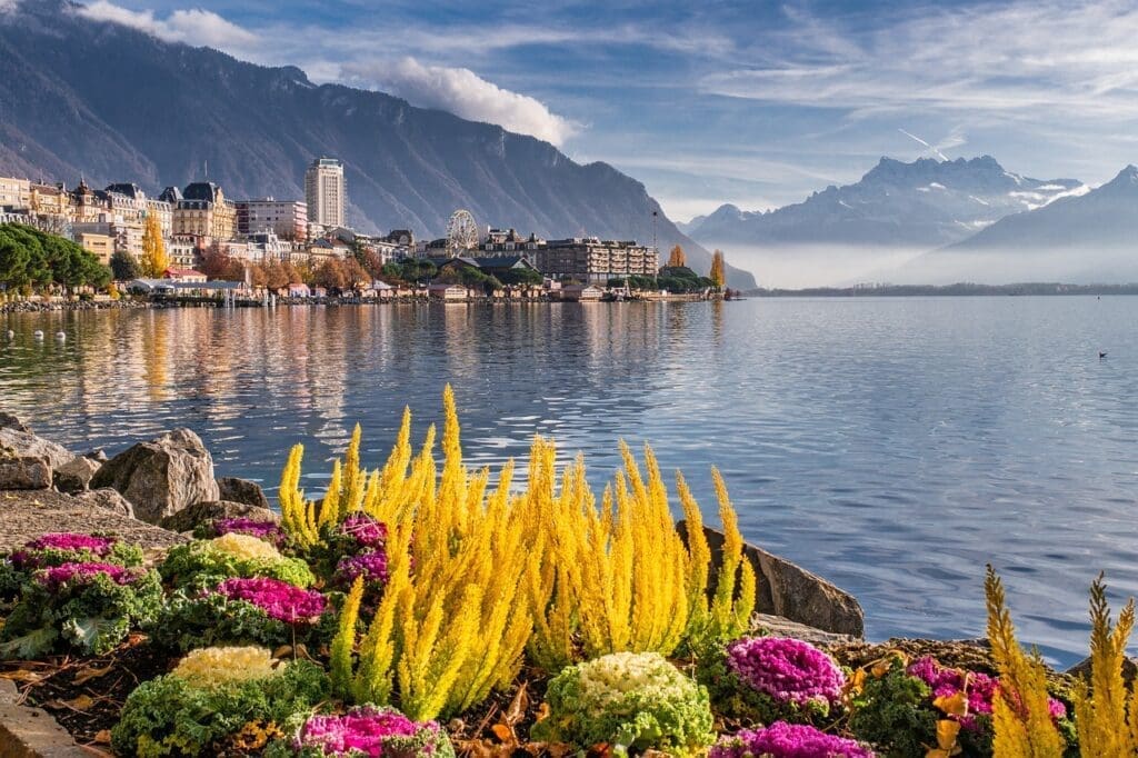 View of Lake Geneva with palm trees along the Montreux coast.